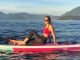 Surfing stunner: Woman wakesurfs on lake in high heels, sips coffee, reads while ‘on board’