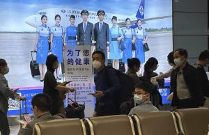 China to start issuing new passports as virus curbs ease